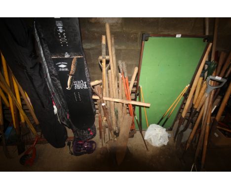 A quantity of gardening tools to include a stirrup pump; a shovel; a hay knife; shears etc.