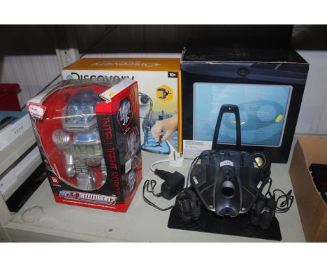 A Rovio mobile webcam, a Discovery robot arm and a boxed robot