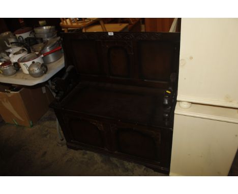 A reproduction Monks bench