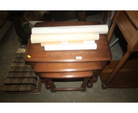 A nest of three Ercol tables
