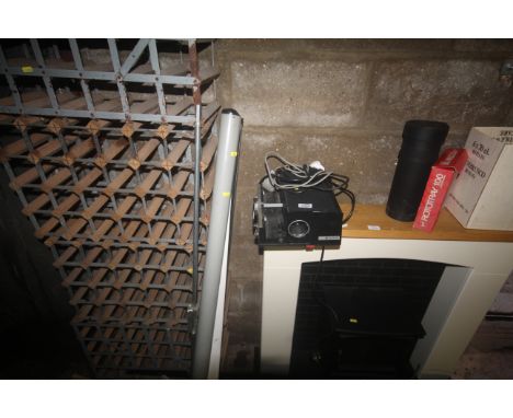 A Gaf 600 Auto slide projector; a projector screen and a quantity of slide storage racks