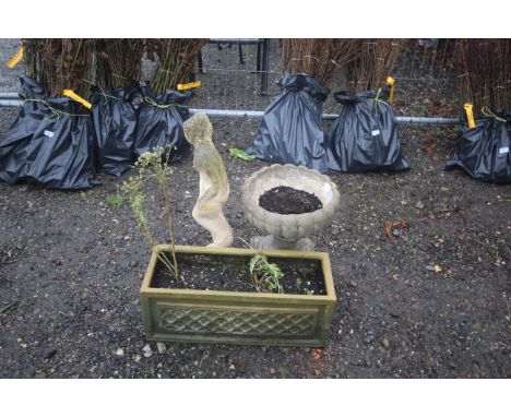 A cast concrete and painted statue of a maiden, an urn shaped plant pot and a concrete plant trough