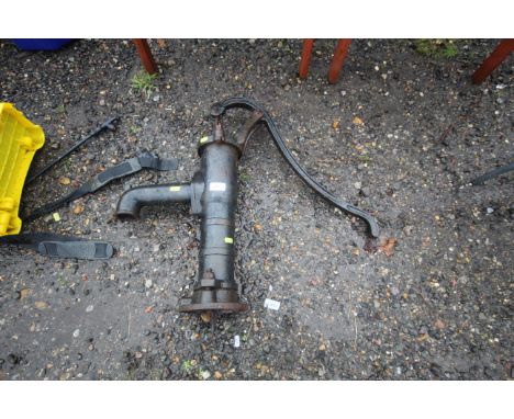 A vintage cast iron hand water pump