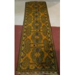 An Eastern runner with repeating stylised star medallions within geometric multi borders. L.290 W.