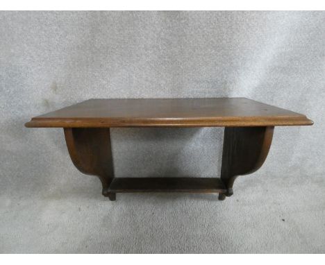 A 19th century mahogany wall bracket. H.44 W.60 D.34cm 