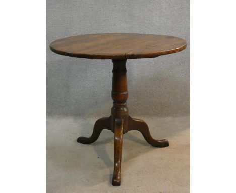 A Georgian elm occasional table on tripod cabriole base. H.65 D.71cm 