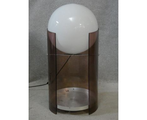 A vintage globe lamp on smoked perspex frame fitted with aluminium undertier. H.77cm 