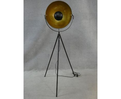 A retro styled tripod floor standing spotlight lamp with enamel interior and gold foil detail. H.143CM 