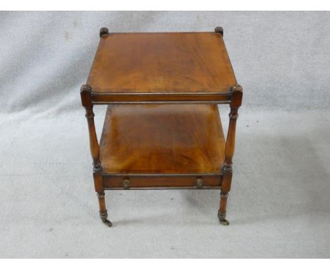 A late 19th century mahogany and crossbanded lamp table on turned supports united by undertier fitted with base drawer. H.59 