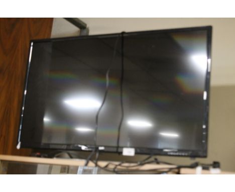 A JVC 32" FLATSCREEN TV WITH LIGHT SCRATCHES TO THE SCREEN, WITH REMOTE