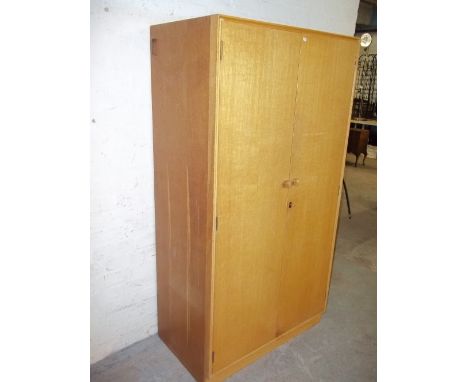 A LIGHT OAK WARDROBE