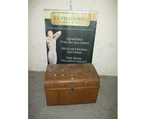 A LARGE METAL TRAVEL TRUNK