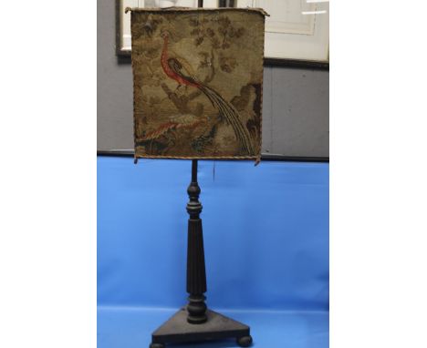 A TAPESTRY FIRESCREEN DEPICTING AN EXOTIC BIRD