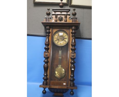A HANGING WALL CLOCK A/F WITH KEY AND PENDULUM