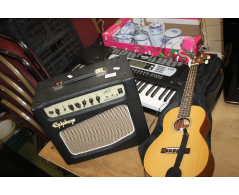 AN EPIPHONE AMPLIFIER, AN ELECTRIC KEYBOARD (NO PLUG) AND A SMALL ACOUSTIC GUITAR
