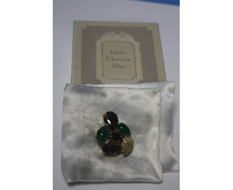 A BOXED CHRISTIAN DIOR BROOCH Condition Report: The central stone has a chip by one of the claw fittings.  Stones are loose w