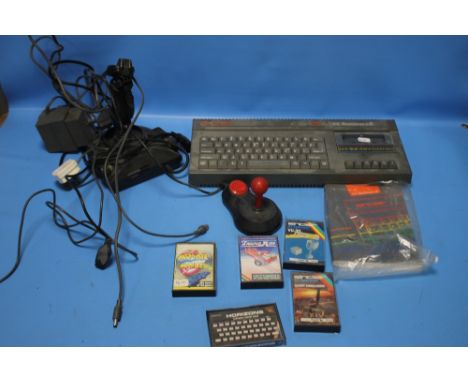 A SINCLAIR ZX SPECTRUM +2 WITH A SMALL COLLECTION OF GAMES, JOY STICK ETC.  A/F