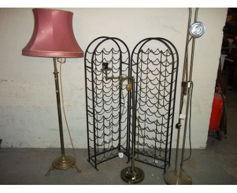 A FLOORSTANDING STANDARD LAMP IN BRASS AND TWO MODERN EXAMPLES WITH TWO WINE BOTTLE RACKS