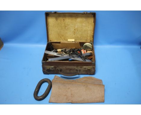 A VINTAGE SMALL SUITCASE TO INCLUDE A QUANTITY OF VINTAGE TOOLS AND A PIECE OF LEATHER