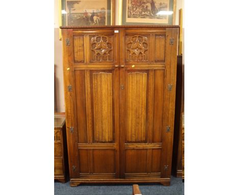 A VINTAGE OAK LINEN FOLD TWO DOOR WARDROBE W- 124 CM X H- 185 CM X D-52 CM