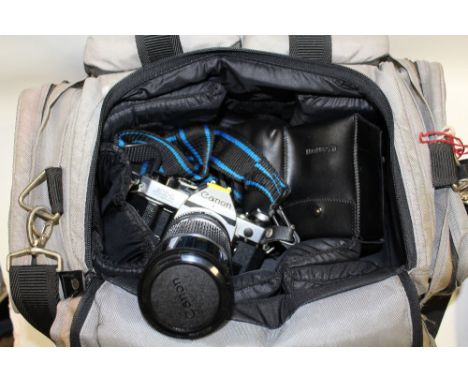 A VINTAGE CANON AE-1 PROGRAMME CAMERA AND ACCESSORIES