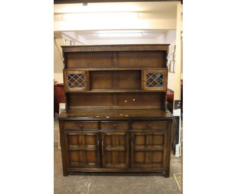 A VINTAGE OAK CARVED DRESSER WITH DRAWERS AND CUPBOARDS W 155 CM X D 46 CM X H 185 CM