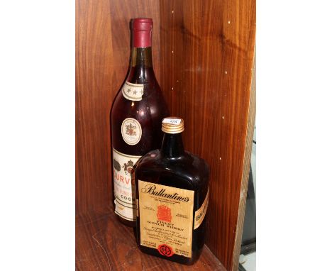 A LARGE SHOP DISPLAY COURVOISIER COGNAC BOTTLE, TOGETHER WITH A LARGE BALLANTINES SCOTCH WHISKY BOTTLE (2)