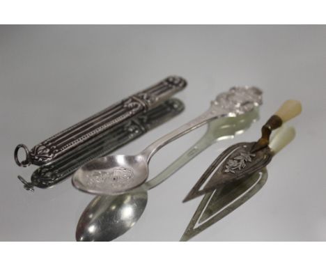 A STERLING SILVER NEEDLE CASE, TOGETHER WITH A TROWEL SHAPED BOOKMARK AND A SPOON (3)