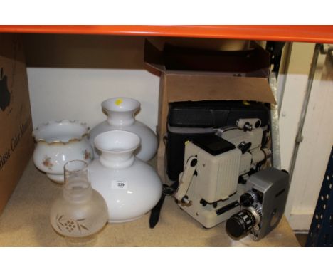 A VINTAGE EUMIG PROJECTOR TOGETHER WITH A KOPIL ELECTRIC EYE CAMERA AND FOUR GLASS LIGHT SHADES