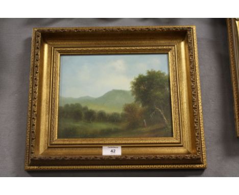 A GILT FRAMED OIL ON BOARD OF A FIGURE IN A COUNTRY LANDSCAPE SIGNED R WITCHARD