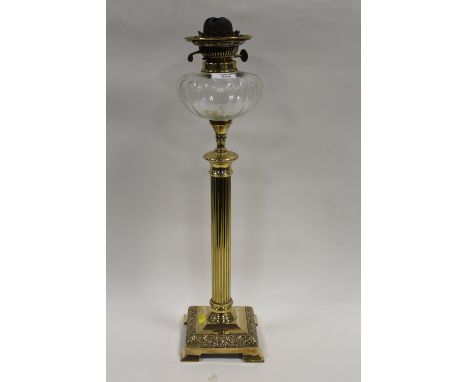 A BRASS AND GLASS COLUMN OIL LAMP 
