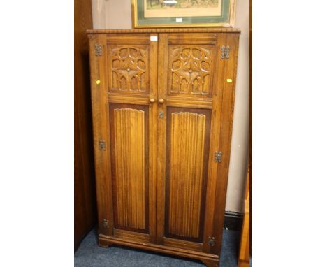 A VINTAGE OAK LINEN FOLD TWO DOOR WARDROBE W-90 CM X H- 155 CM X D- 46 CM