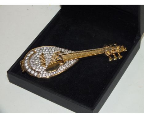 A SWAROVSKI CRYSTAL LUTE SHAPED BROOCH