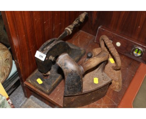 A VINTAGE PRESS AND TWO VINTAGE IRONS