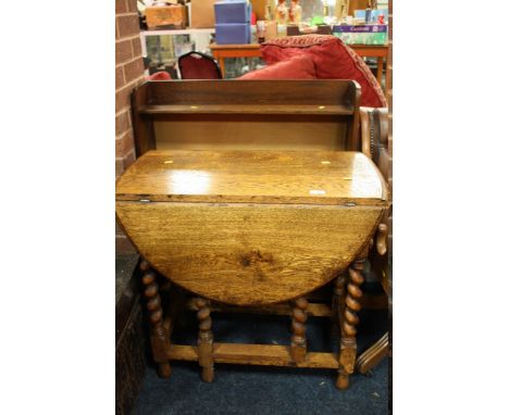 A VINTAGE OAK DROPLEAF TABLE TOGETHER WITH AN OAK FOUR SHELF BOOKCASE (2)