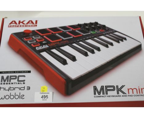 AN AKAI PROFFESIONAL MPK MINI COMPACT KEYBOARD AND PAD CONTROLLER