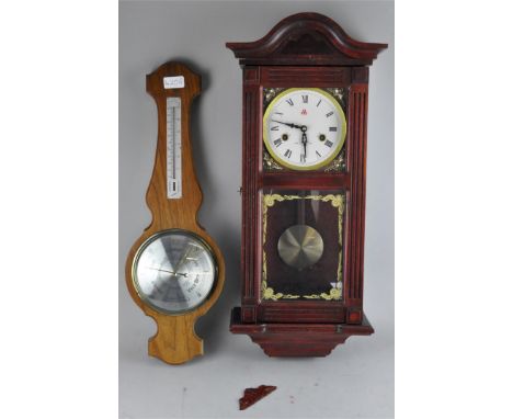 A modern wall clock, 65cm high, together with a wall barometer by Cormitti of London