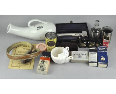 A group of medical collectable's including a lamp and various glass bottles