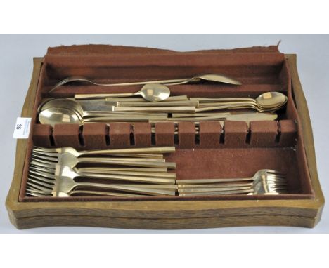 A collection of vintage brass cutlery, made in Thailand, including knives, forks and more