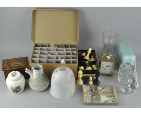 An assortment of collectables, including a carriage clock, 2 chess sets and other items