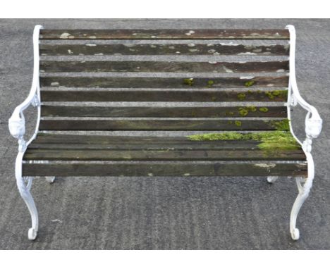 A white painted and slatted garden bench, 130cm wide 