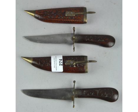 Two vintage daggers with carved wooden sheaths and handles, 21cm long