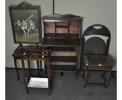 An oak student's desk, 104cm high, two side tables, an umbrella stand, a folding chair and a fire screen, largest 110cm