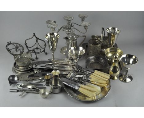 A quantity of assorted silver plate, including a candelabra, salver tray, flat ware and more