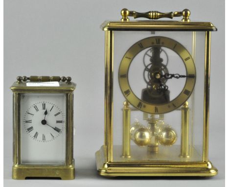 An H Samuel brass cased Anniversary clock, 21cm high, together with a brass cased carriage clock