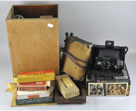 A collection of assorted camera equipment, to include Polaroid EE 100, an Astro cine projector and another