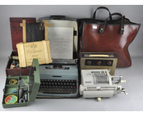 An assorted collection of items, including a typewriter, a retro radio, fish tackle, flies and more