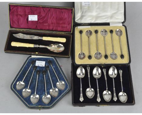 Four cased sets of silver flatware, including three sets of coffee spoons, and a bone handled Christening spoon and knife set