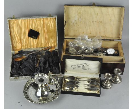 A collection of assorted silver plated items, including an ornate chamber stick, boxed flatware and more