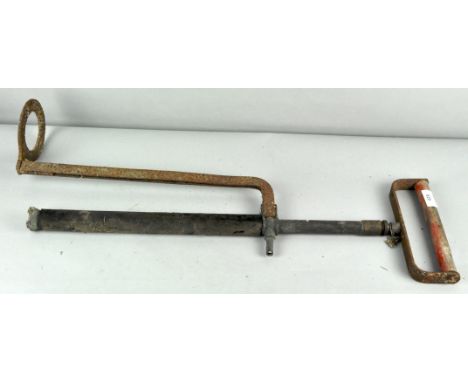 A vintage stirrup tyre pump, 72cm high